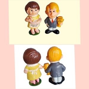 Vintage hard plastic mom and dad figurines